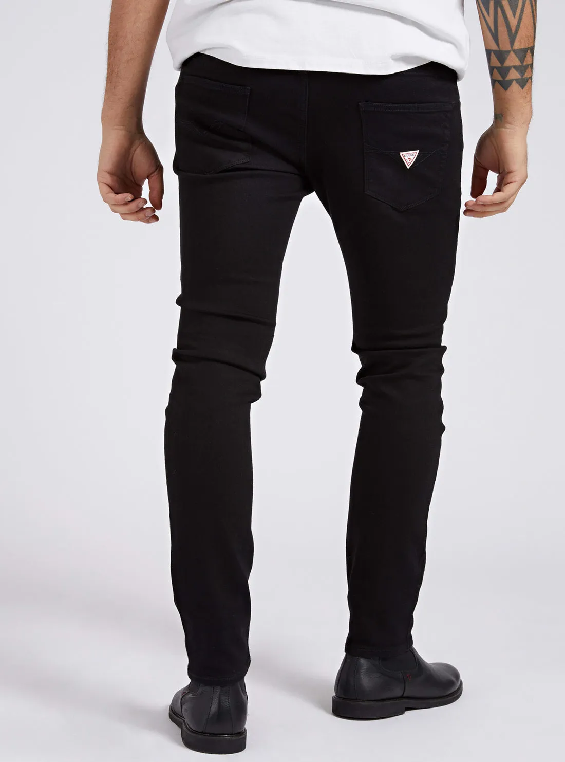 Chris Mid-Rise Super Skinny Denim Jeans in Black